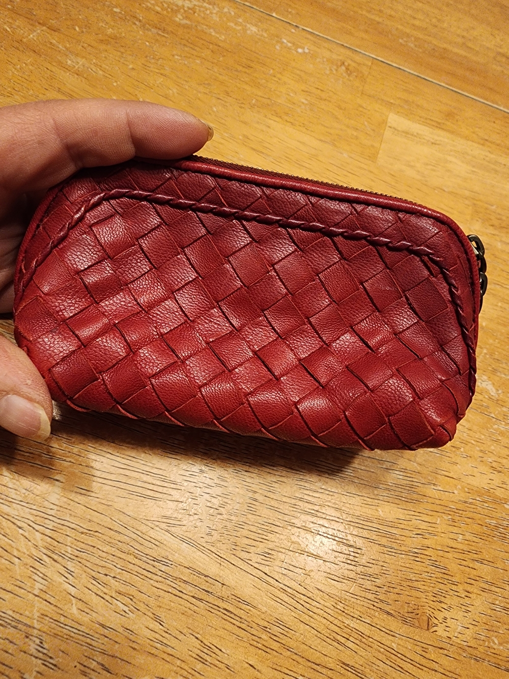 red Bottega Veneta Intrecciato leather pouch  brand's signature woven Design
